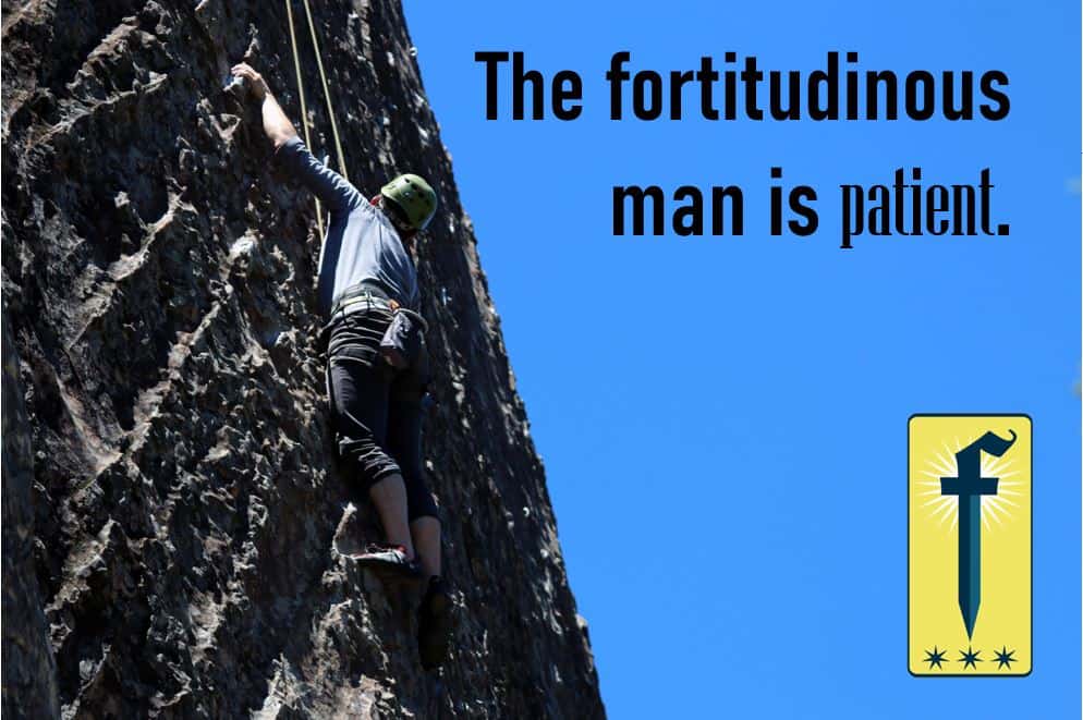 A Man climbing up a wall